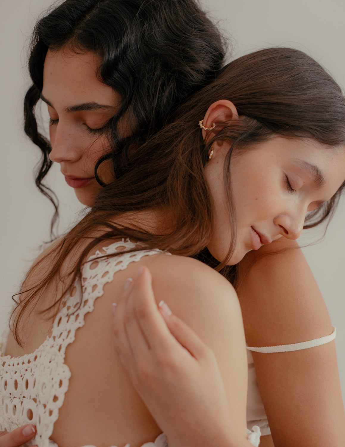 Cassandra and Amanda resting closely against each other
